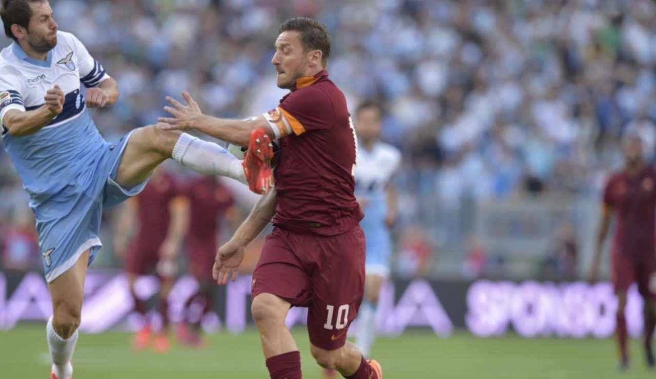 Senad Lulic e Francesco Totti - Lapresse - Ilromanista.it